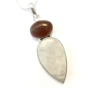 2 inch pendant. 1 1/2 in Hememorphite and Carnelian pendant on a silver chain.